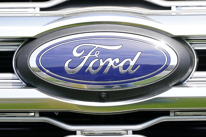 A logo on a vehicle at a Ford dealership in Springfield, Pa., Tuesday, April 26, 2022. Ford is recalling more than 1.5 million vehicles in the U.S. in two actions to fix leaky brake hoses and windshield wiper arms that can break. The company says in documents posted Friday, March 17, 2023 by safety regulators that the front brake hoses can rupture and leak brake fluid. (Matt Rourke/AP, File)