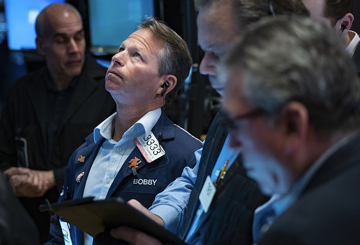 Traders work on the floor at the New York Stock Exchange in New York, Monday, March 13, 2023. (Craig Ruttle/AP)