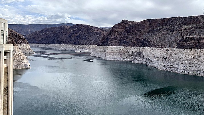 The drought has eased due to recent rain and storms, but not enough for the Colorado River to fill Lake Mead and Lake Powell. Lake Mead’s bathtub ring is pictured near the Hoover Dam. (Photo by APK, cc-by-sa-4.0, https://bit.ly/3Vy6BSB)
