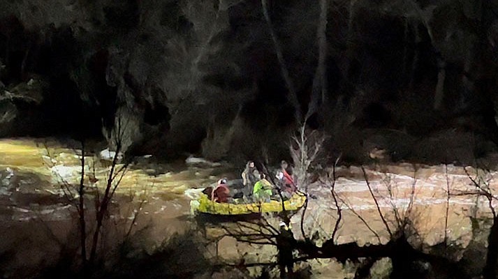 Family rescued from vehicle in high water
