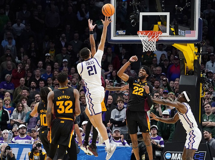 TCU forward JaKobe Coles (21) drives the lane for a basket past Arizona State forwards Alonzo Gaffney (32) and Warren Washington (22) during the second half of a first-round game in the men's NCAA Tournament on Friday, March 17, 2023, in Denver. (John Leyba/AP)