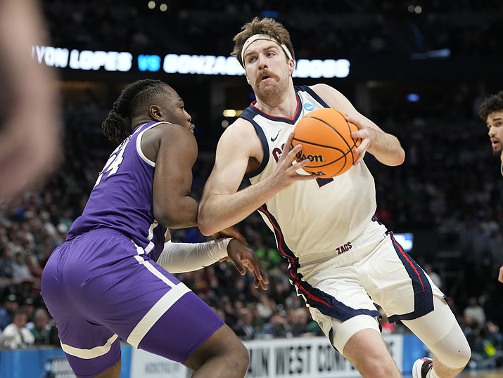 Gonzaga forward Drew Timme, right, drives past Grand Canyon forward Yvan Ouedraogo during the first half of a first-round game in the men’s NCAA Tournament on Friday, March 17, 2023, in Denver. (David Zalubowski/AP)