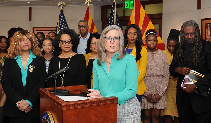 Arizona Gov. Katie Hobbs explains Friday why she signed an order designed to preclude discrimination against Black employees and those who work with firms that contract with the state because of how they wear their hair. (Howard Fischer/Courtesy)