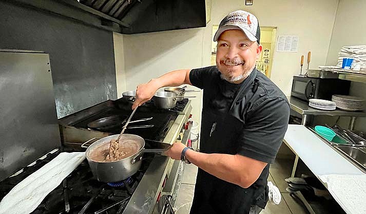 Efrain Gomez makes beans while prepping early Thursday morning at Bocha’s Mexican & American Restaurant in Cottonwood. (VVN/Vyto Starinskas)