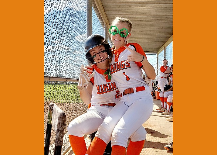 Riley McNelly (left) and Cheznie Carter strike a pose in the dugout. (Photo/Renee Hatch)