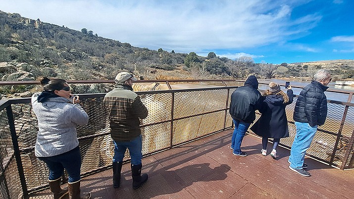 Onlookers flock to the waterfalls at Fain Park, in Prescott Valley, on the morning of Wednesday, March 22, to watch the rushing waterfalls caused by ongoing snowmelt. (Debra Winters/Courier)