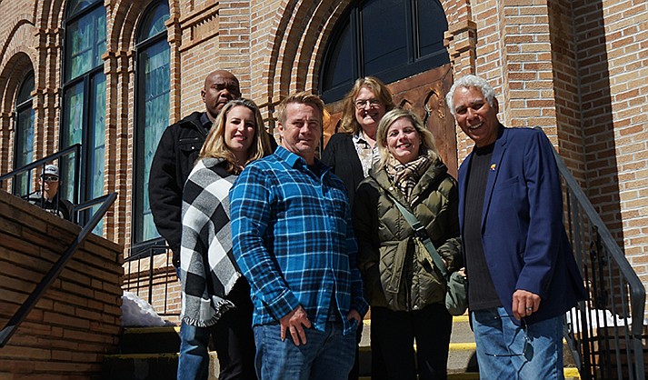 During filming at the First Congregational Church on Gurley Street in downtown Prescott Friday, March 3, 2023, Arizona Film Commissioner Matthew Earl Jones, right, meets with representatives of the “Mysteries of the Heart” movie. Those involved with the movie include Nicely Entertainment Production Executive Dave Hickey, front left, and CEO Vanessa Shapiro, front center. Also meeting with Jones were Line Producer Rochelle Savory and Jon Wright of Maven Production Services, left, and Helen Stephenson, director of Film and Media Arts at Yavapai College, right back row. (Cindy Barks/Courier)