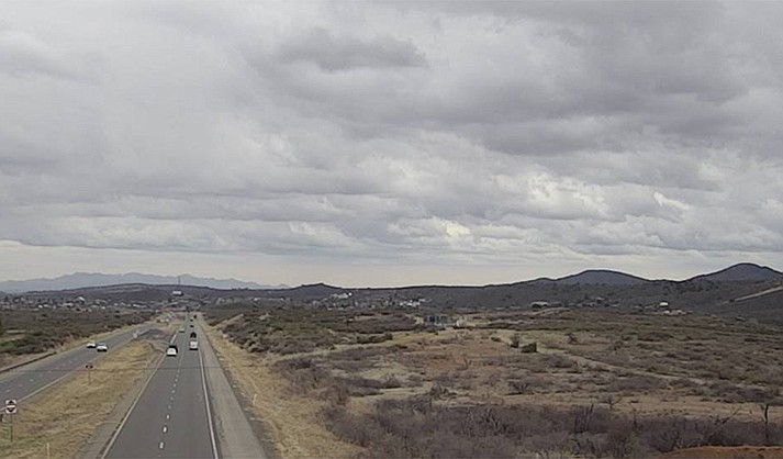 Storm clouds loom across Northern Arizona on Monday as another storm system moved in with more rain predicted. (ADOT)