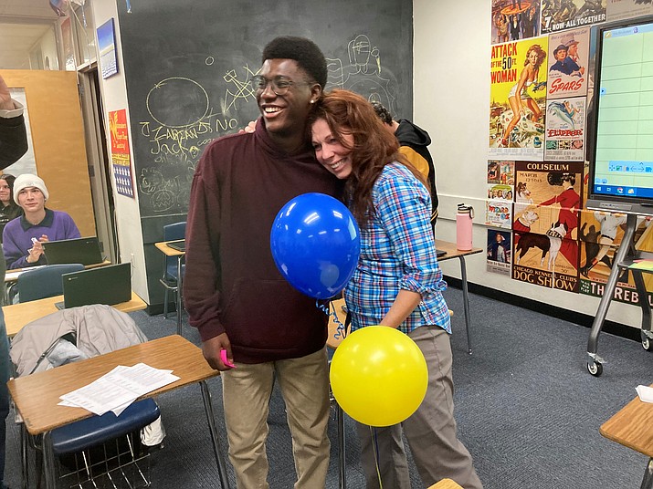 “Rising Stars” senior Maurea Norris delivers balloons to his favorite educator, PHS English teacher Helen Wanamaker. (Nanci Hutson/Courier)