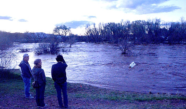 Rezzonico Family Park in Camp Verde continued to serve as a scenic overlook as residents checked out the rush of the Verde River Wednesday night, March 22, 2023. (VVN/Raquel Hendrickson)