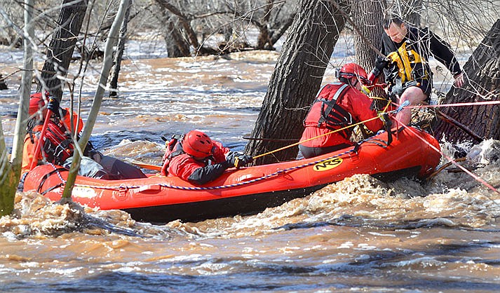 A man stuck in a tree in a raging flooded river in Camp Verde is rescued by swift water teams from Copper Canyon Fire and Verde Valley Fire Districts Wednesday afternoon, March, 22, 2023. (VVN//Vyto Starinskas)