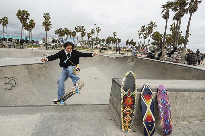 Expert skateboarder Di'Orr Greenwood, an artist born and raised in the Navajo Nation in Arizona and whose work is featured on the new U.S. stamps, exits the concrete bowl in the Venice Beach neighborhood in Los Angeles Monday, March 20, 2023. On Friday, March 24, the U.S. Postal Service is debuting the "Art of the Skateboard," four stamps that will be the first to pay tribute to skateboarding. The stamps underscore how prevalent skateboarding has become, especially in Indian Country, where the demand for designated skate spots has only grown in recently. (Damian Dovarganes/AP)