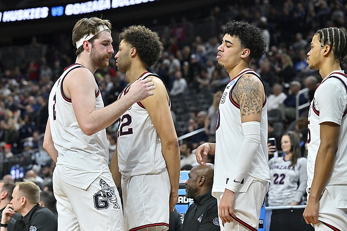 Gonzaga forward Drew Timme, left, hugs with teammates while checking out of the game during the final minutes in the second half of an Elite 8 college basketball game against UConn in the West Region final of the NCAA Tournament, Saturday, March 25, 2023, in Las Vegas. (David Becker/AP)