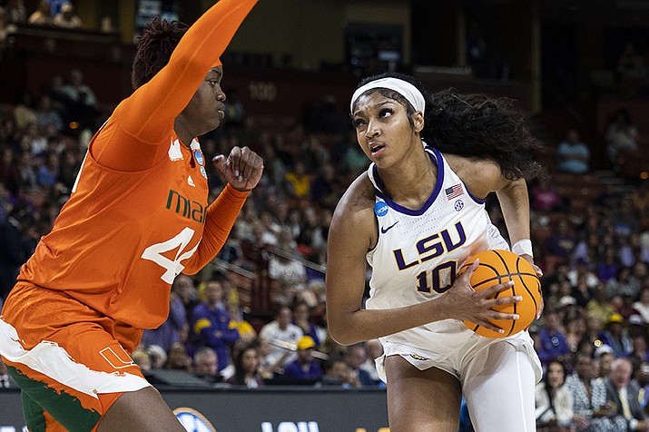 LSU's Angel Reese (10) goes up to shoot over Miami's Kyla Oldacre (44) in the first half of an Elite 8 college basketball game of the NCAA Tournament in Greenville, S.C., Sunday, March 26, 2023. (Mic Smith/AP)