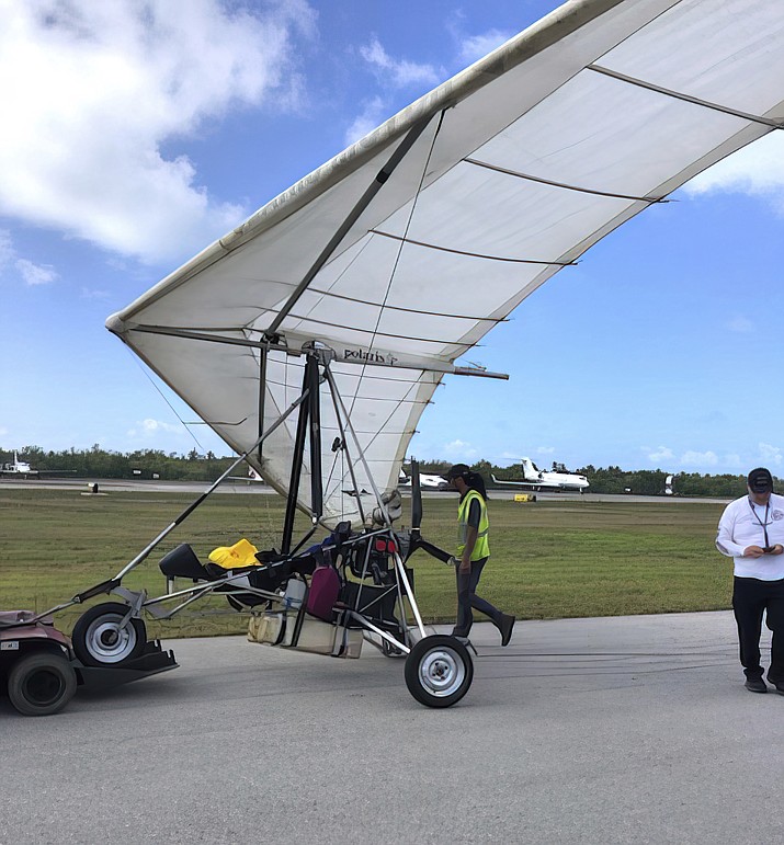 Key West International Airport personnel examine an ultralight aircraft that landed illegally at the airport carrying two Cuban men Saturday, March 25, 2023, in Key West, Fla. (Monroe County Sheriff’s Office /the Florida Keys News Bureau via AP)