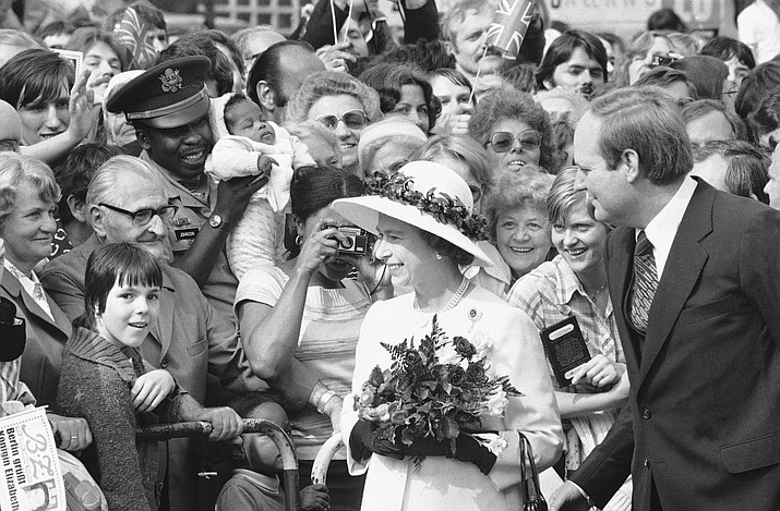 People gather to greet Britain’s Queen Elizabeth II as she walked along the famous Kurfuerstendamm Boulevard in West Berlin, Germany, on May 24, 1978. One would like two horses. That, in effect, was the gift requested by Britain’s Queen Elizabeth II during her state visit to Germany in 1978, weekly Der Spiegel reported Monday, March 27, 2023. (AP Photo, File)