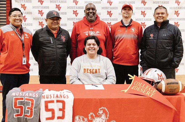MVHS Principal Ryan Dodson, MVHS Head Football Coach Bryan Begay, MVHS Offensive Coordinator Jason Franklin and KUSD Athletic Director Stephen Young, celebrate Keegan Holiday's commitment to College of the Desert at a signing ceremony.  (Photo/MVHS Athletics)
