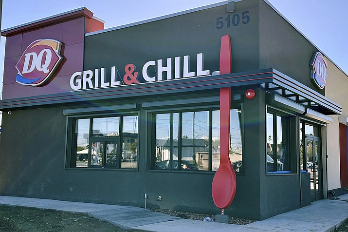 This undated image provided by Raman and Puja Kalra shows their Dairy Queen franchise restaurant in Phoenix with 15-foot-tall red spoon. The owners remain perplexed — and slightly amused — as to why someone would steal the giant red spoon that adorned their restaurant. (Raman and Puja Kalra via The AP)