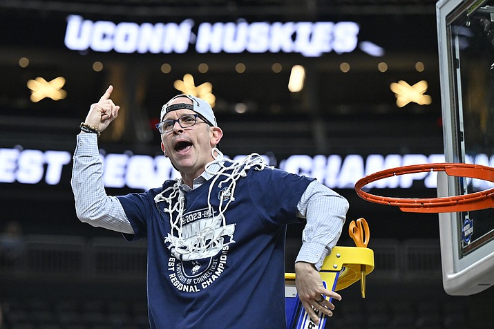 UConn head coach Dan Hurley celebrates after cutting down the netting from the 82-54 win against Gonzaga of an Elite 8 game in the West Region final of the NCAA Tournament, Saturday, March 25, 2023, in Las Vegas. (David Becker/AP)
