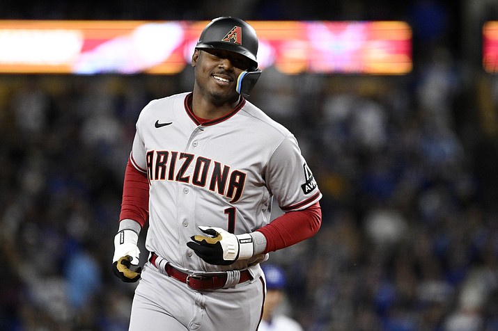 Arizona Diamondbacks' Kyle Lewis heads to third after hitting a two-run home run during the eighth inning of a game against the Los Angeles Dodgers Friday, March 31, 2023, in Los Angeles. (Mark J. Terrill/AP)