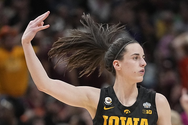 Iowa’s Caitlin Clark reacts after a three pointer during the second half of an NCAA Women’s Final Four game against South Carolina Friday, March 31, 2023, in Dallas. (Darron Cummings/AP)