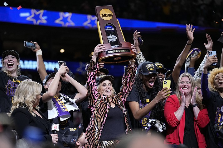 LSU head coach Kim Mulkey holds the winning trophy after the NCAA Women's Final Four championship game against Iowa Sunday, April 2, 2023, in Dallas. LSU won 102-85 to win the championship. (Tony Gutierrez/AP)