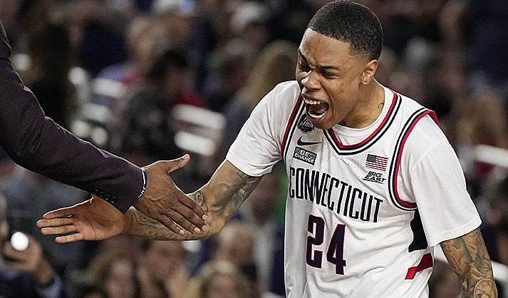 Connecticut guard Jordan Hawkins celebrates during the second half of the men's national championship college basketball game against San Diego State in the NCAA Tournament on Monday, April 3, 2023, in Houston. (AP Photo/Brynn Anderson)