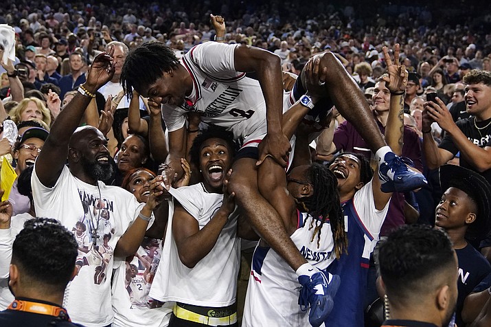 Connecticut guard Tristen Newton celebrates after their win against San Diego State during the men's national championship college basketball game in the NCAA Tournament on Monday, April 3, 2023, in Houston. (Brynn Anderson/AP)