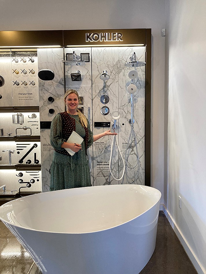 Design Manager Maggie O’Neil in front of Kohler display (VVN/ Paige Daniels)