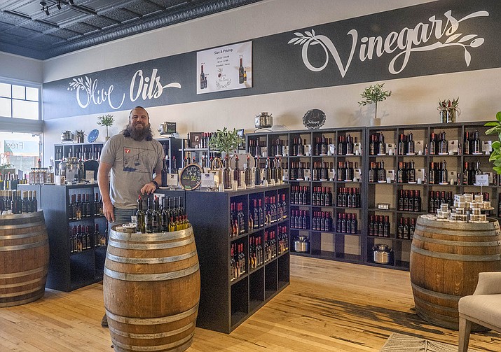 Olive the Best hosted a soft opening for their Williams location on April 7. Here, owner Scotty McPeak poses in the showroom. (V. Ronnie Tierney/WGCN)