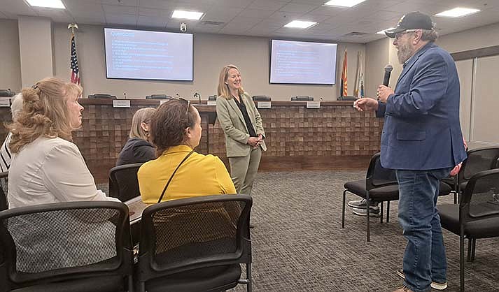 Arizona Attorney General Kris Mayes speaks with Steve Zipperman of Prescott, as Prescott Valley Council members Brenda Dickinson and Lucy Leyva, at left, look on.  (Debra Winters/Courier)