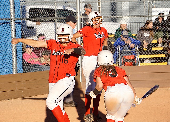 Bradshaw Mountain outfielder Inez Hatori Laa Cambra (16), pitcher Yasmine Bernal (6) and catcher Grace Roberts (3) celebrate after scoring a couple of runs during extra innings of a game against Prescott on Thursday, April 20, 2023, in Prescott. (Aaron Valdez/Courier)