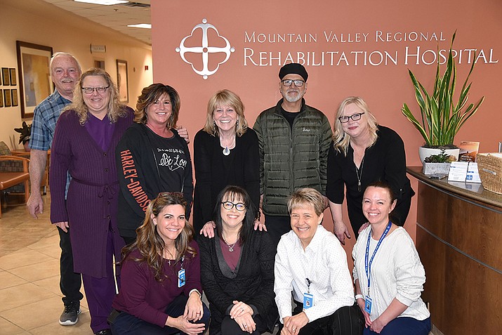 Judy Baum, shown back row center, is retiring after 17 years as chief executive officer of Mountain Valley Rehabilitation Hospital in Prescott Valley. (Ernest Health/Courtesy)
