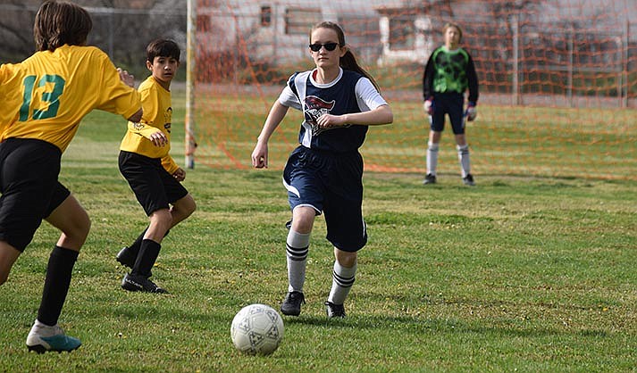 Claire Earles racing the ball down the field. (VVN/Paige Daniels)