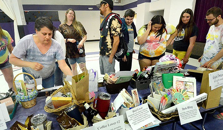 Jeanna Mandeville, left, mom of a 16-year-old sophomore T.J. at the RISE Resource Center, put out gifts for the teachers on Wednesday, April 26, 2023. She also took photos. (VVN/Vyto Starinskas)