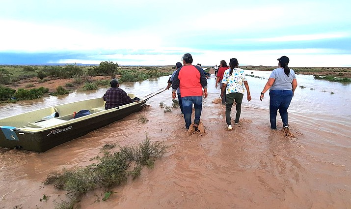 Birdsprings residents evacuate family members from flood waters in August 2021. Flooding is a common event in the Birdsprings Chapter, however, snowmelt has made flooding extreme this year. (Photo/Mitzi Begay)