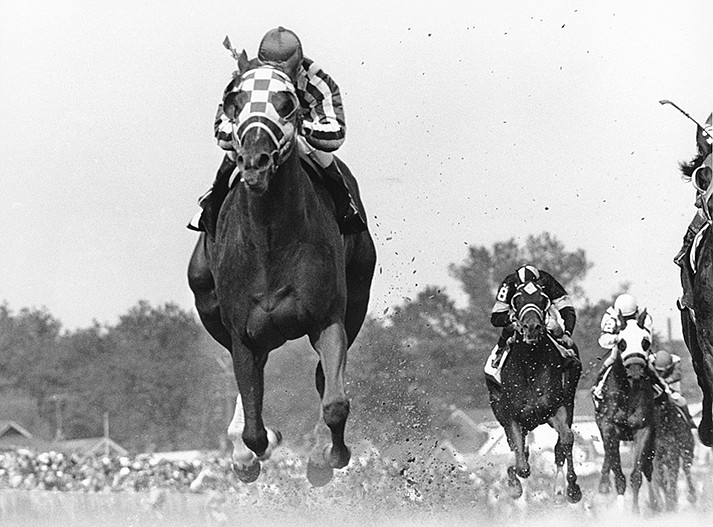 Jockey Ron Turcotte rides Secretariat during the 99th Kentucky Derby at Churchill Downs in Louisville, Ky. on May 5, 1973.Secretariat won the Derby, Preakness and Belmont in record times that still stand. (AP Photo/Bob Daugherty, File)