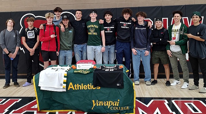 Ben Wilder of Bradshaw Mountain boys basketball stands with teammates and friends after signing with Yavapai College to continue his athletic and academic career on Thursday, May 4, 2023.(Thomas Staples/Courier)