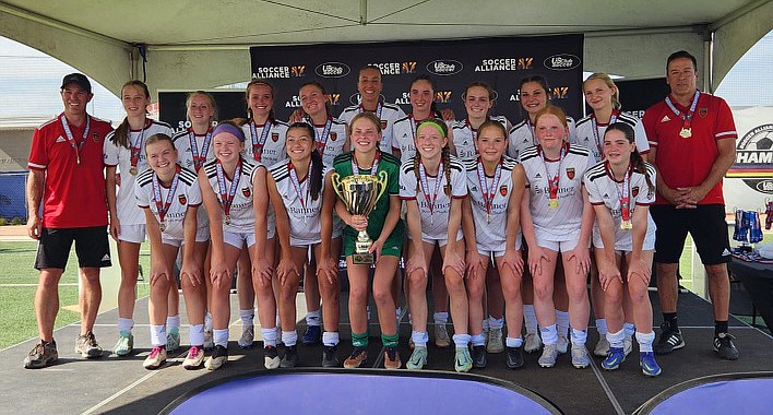 The Phoenix Rising U16 club soccer team, which is made up entirely of girls from Prescott, takes a photo after winning the Arizona State Champions Cup tournament on Sunday, April 30, 2023, in Mesa. (MacKenzie VanWormer/Courtesy)