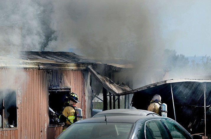 Firefighters extinguish a house fire in the Verde Villages Sunday, May 7, 2023. (VVN/Vyto Starinskas)