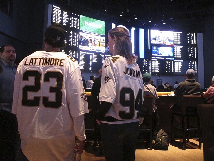 Customers at the Ocean Casino Resort in Atlantic City N.J. on Sept. 9, 2018, await the kickoff of the first NFL season after a US Supreme Court ruling clearing the way for legal sports betting. Americans have bet over $220 billion on sports with legal gambling outlets in the five years since that ruling. (Wayne Parry/AP, File)