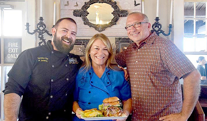 Michelle and Eric Jurisin with their son, Eric Jurisin Jr. and their award-winning ‘Haunted Burger’ (VVN/Paige Daniels)