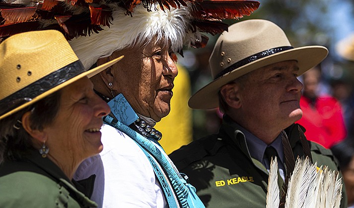 Jan Balsom, left, Havasupai ceremonial practitioner Uqualla and Grand Canyon National Park Superintendent Ed Keable pose for a photograph Thursday, May 4, 2023, at the park's South Rim. The Havasupai Tribe and the park marked the renaming of a popular campground below the rim from Indian Garden to Havasupai Gardens. (AP Photo/Ty O'Neil)