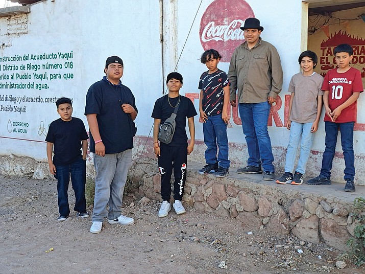 Members of the Pascua Yaqui Tribe pose for a photo in their tribal community in Sonora, Mexico. in March 2023. (Raymond V. Buelna via AP)