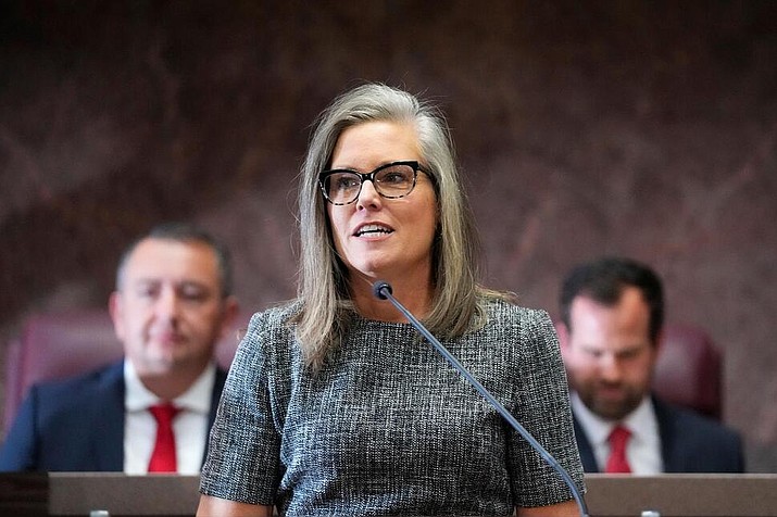 FILE - Democratic Arizona Gov. Katie Hobbs, makes her State of the State address at the Arizona Capitol in Phoenix on Jan. 9, 2023. On Wednesday, May 10, the Arizona Legislature approved a $17 billion budget package that was negotiated by Hobbs and Republican legislative leaders. Democratic lawmakers criticized the package for failing to put limits on an expansion of a school voucher program that they say is a drain on the state's budget. (AP Photo/Ross D. Franklin,File)