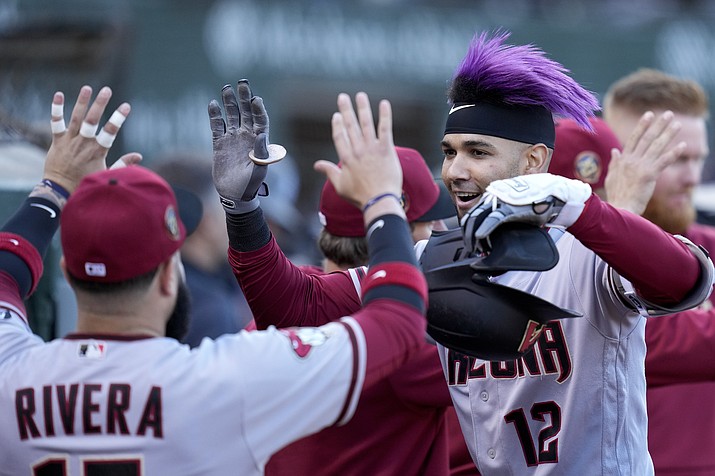 Arizona Diamondbacks' Lourdes Gurriel Jr. gives a Diamondbacks fan