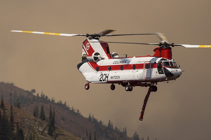 A bipartisan bill sponsored by Sen. Mark Kelly (D-AZ) and Cynthia Lummis (R-WY) would allow leased planes and helicopters to carry wildland fire personnel. (Photo/National Interagency Fire Center)
