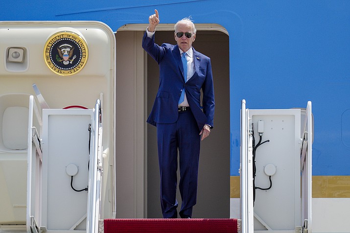 President Joe Biden gestures as he boards Air Force One at Andrews Air Force Base, Md., Wednesday, May 17, 2023, as he heads to Hiroshima, Japan to attend the G-7. (Jess Rapfogel/AP)