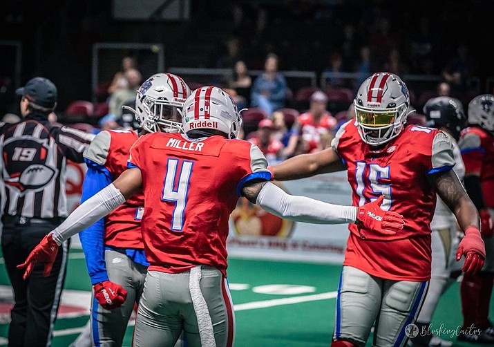 Northern Arizona Wranglers defensive back Terik Miller (4) and defensive end Ch’aim Smith (15) celebrate during a game against the Bay Area Panthers on Saturday, May 13, 2023, at the Findlay Toyota Center in Prescott Valley. (Blushing Cactus Photography/Courtesy)