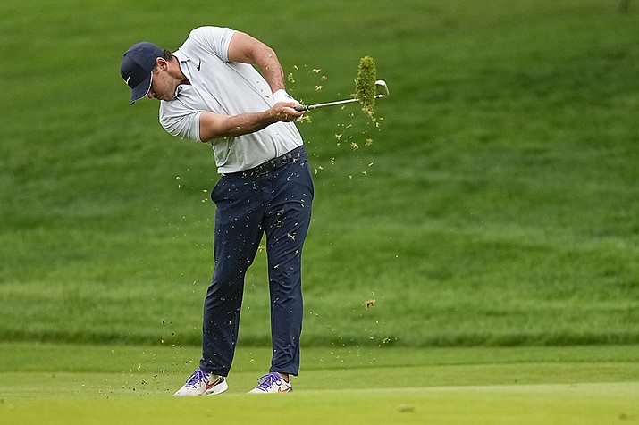 Brooks Koepka hits from the fairway on the seventh hole during the third round of the PGA Championship golf tournament at Oak Hill Country Club on Saturday, May 20, 2023, in Pittsford, N.Y. (Abbie Parr/AP)